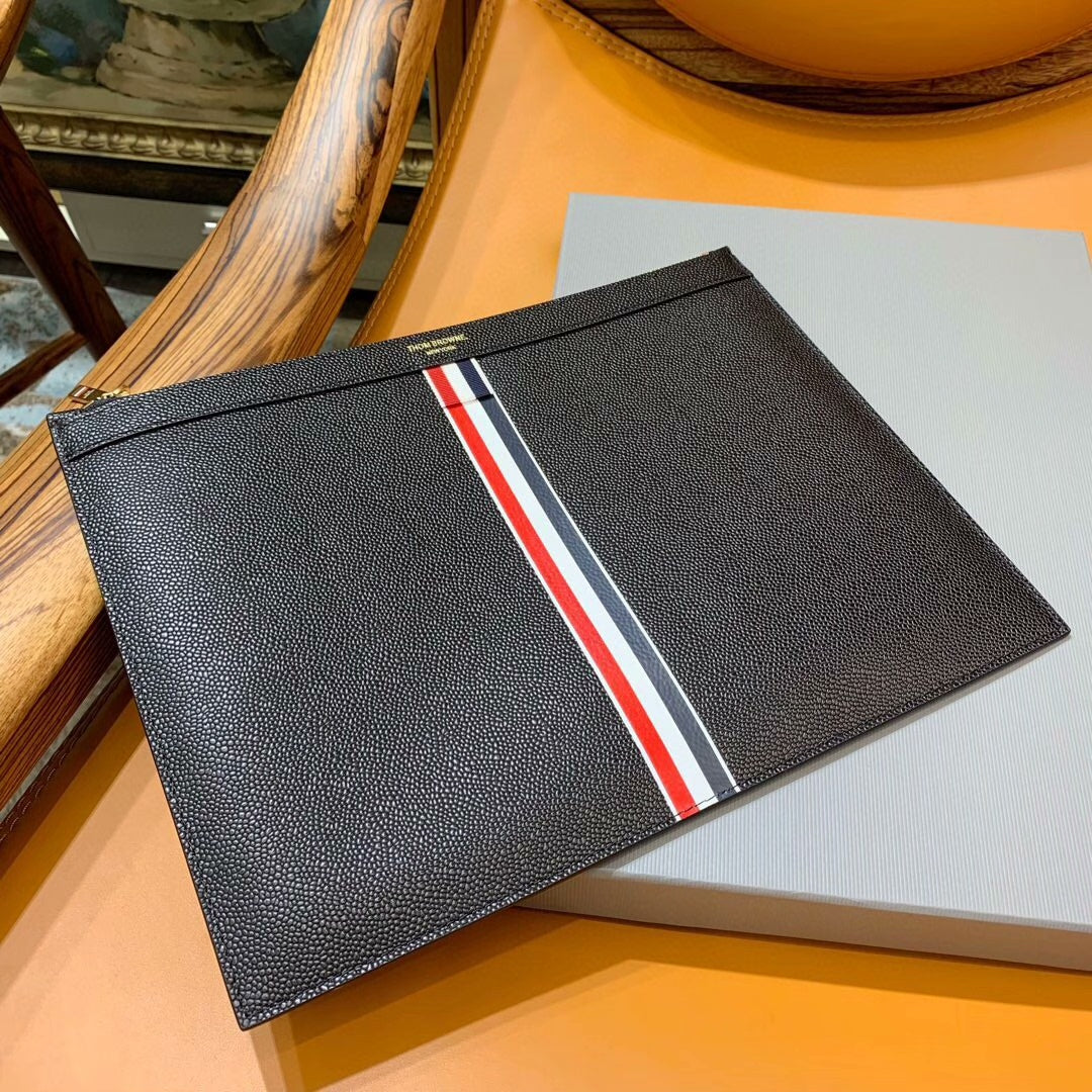 Three-color woven clutch bag